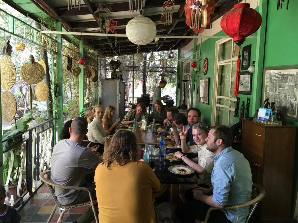 Group dining experience in the green dining room